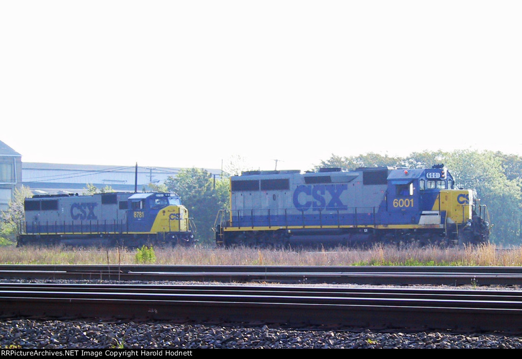 CSX 6001 rolls past CSX # 8781 near the Emerson Shops